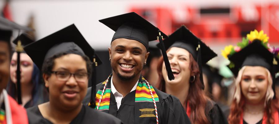 Students smiling at graduation