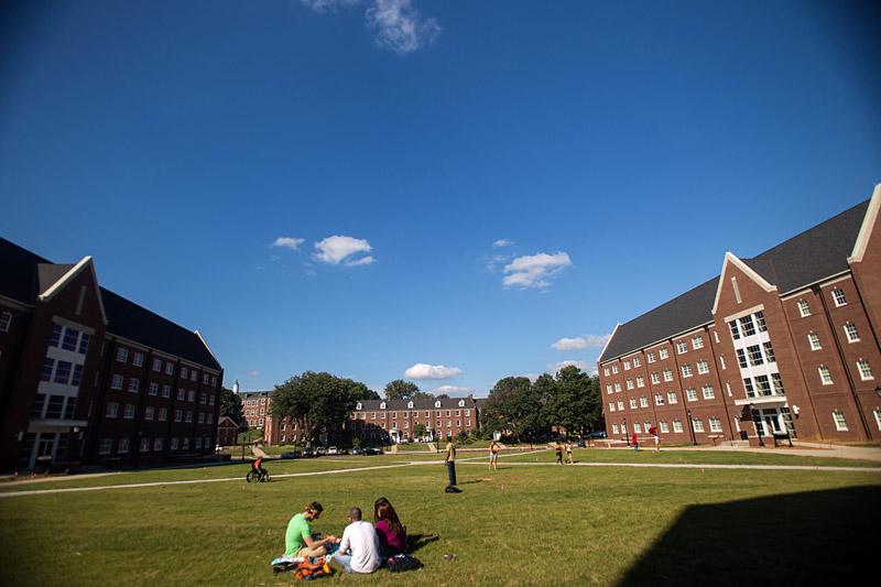 Students sitting on the grass in the Quad